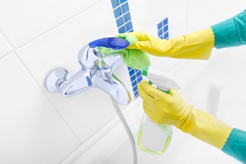 Carpet cleaning process with treatment applied to a floor area